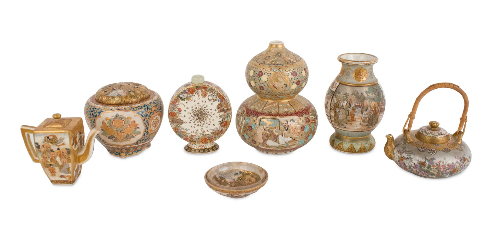Group of Japanese Satsuma Table Articles: Group of Japanese Satsuma Table Articles Including, vases, moon vases, teapots, and a dish. Wear, surface distress. Largest: 6 1/2 x 5 in. (16.5 x 12.7 cm.)