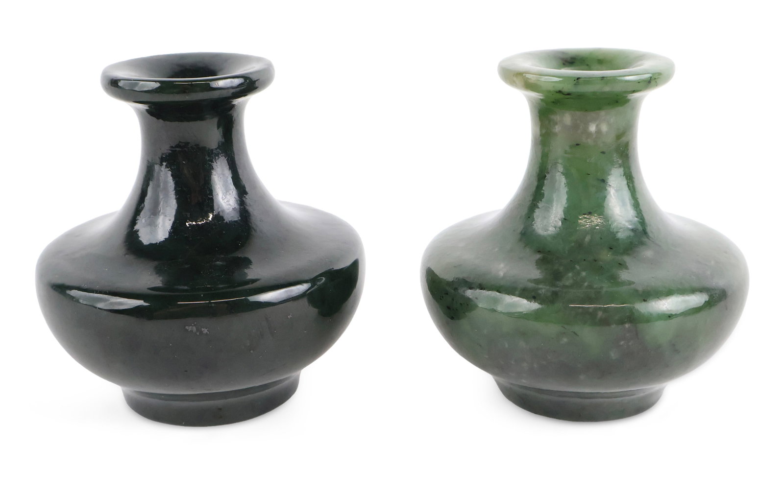 Two Chinese Jade Bud Vases: Two Chinese Jade Bud Vases 20th C. one dark green and one spinach green. Provenance: Property from a Private New York and German Collector 3 3/4 x 3 3/4 in. (9.5 x 9.5 cm.)