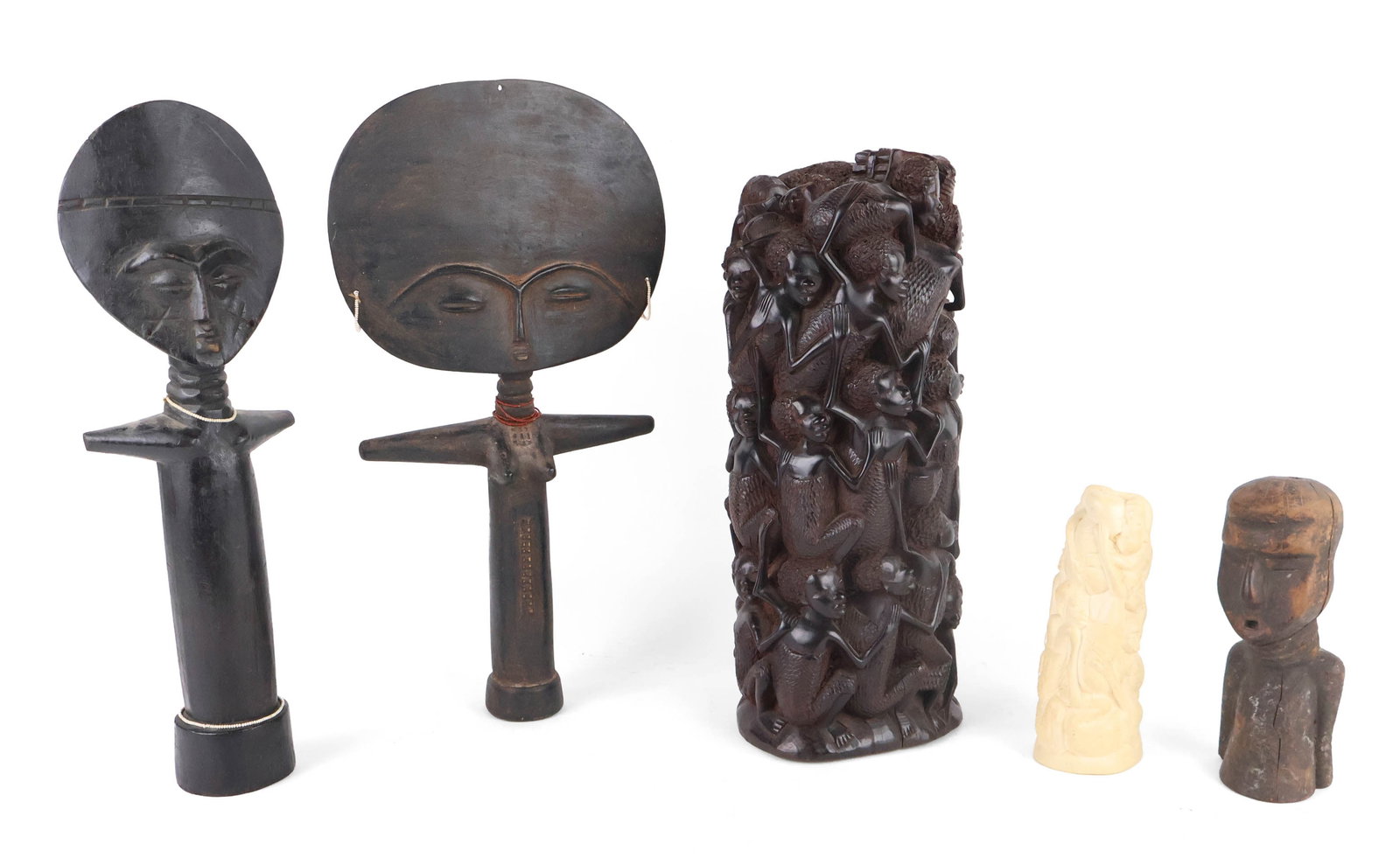 Two Ashanti Fertility Figures: Two Ashanti Fertility Figures Probably reproductions. Together with a carved hardwood bust, a carved bone Ujamaa, and a carved hardwood Ujamaa. Surface distress, wear. Largest: 15 x 6 x 6 in. (38.1 x