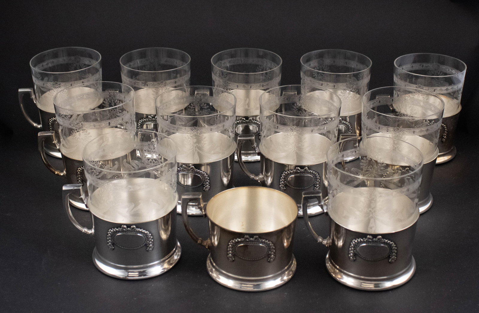 Twelve Argentor Silver Plated and Glass Cups: Twelve Argentor Silver Plated and Glass Cups One etched glass missing. 4 in. (10.2 cm.)