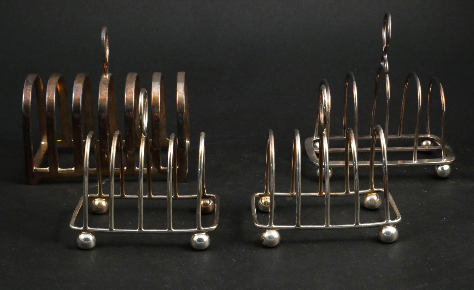 Four Modern Toast Racks: Four Modern Toast Racks In silver plate. Provenance: Property from the Contents of Ellistan, Somerset Hills, NJ 5 in. (12.7 cm.)