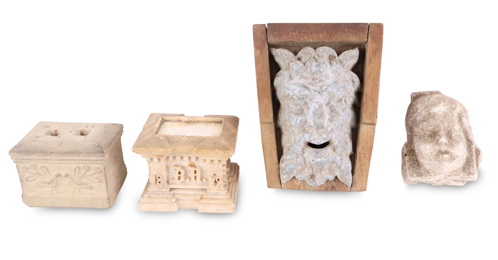 Carved Stone Bust of a Putti: Carved Stone Bust of a Putti Together with a metal head of a gargoyle, and two stone pedestals. Some surface distress, chips, and wear. Largest: 9 1/2 x 7 1/2 x 5 in. (24.1 x 19.1 x 12.7 cm.)