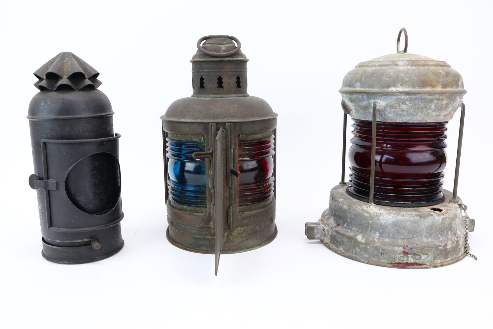 Three Assorted Marine Navigational Lights: Three Assorted Marine Navigational Lights Three Assorted Marine Navigational Lights. Comprising Perko De Lite with blue and red glass, boat signal lantern with interior oil lamp and a red glass lanter