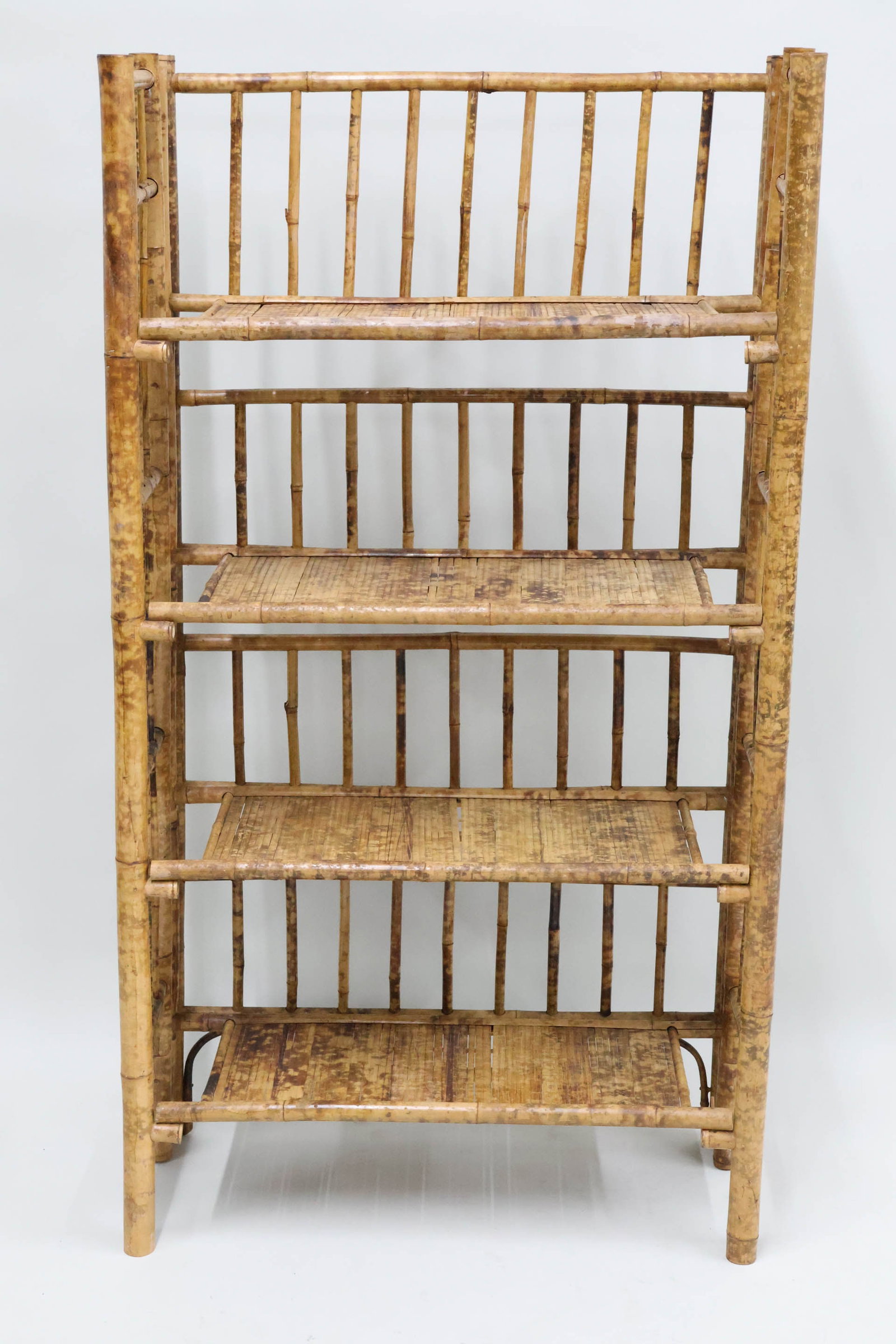 Vintage Rattan 4 Tier Collapsible Bookshelf: Vintage Rattan 4 Tier Collapsible Bookshelf Vintage Rattan 4 Tier Collapsible Bookshelf. Used condition, wear, worn, 51 1/4" x 28" x 12 1/2"
