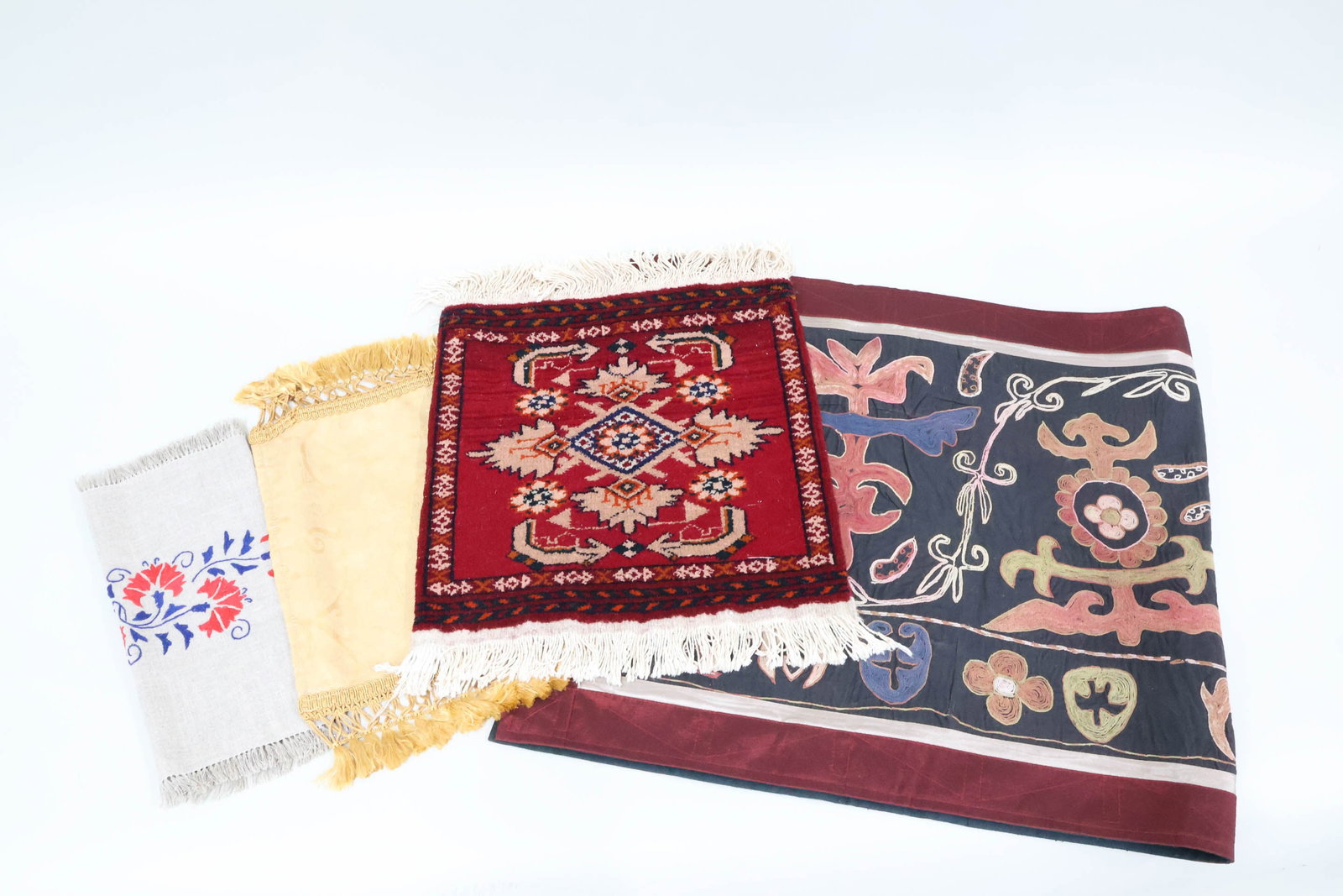 Vintage Suzani Embroidered Wall Hanging: Vintage Suzani Embroidered Wall Hanging Vintage Suzani Embroidered Wall Hanging. Together with a Barokk Art gold matte, Izdelek Domace Obrti embroidered table matte and a Turkish Red ground door matte