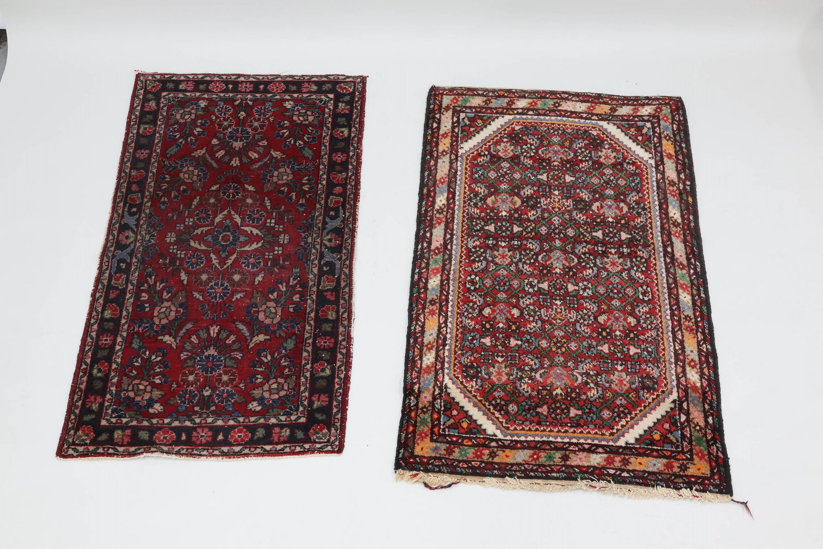 Persian Floral and Geometric Design Area Rug: Persian Floral and Geometric Design Area Rug Persian Floral and Geometric Design Area Rug with saw tooth corners 51" x 32". Together with a Persian rug having central red ground with floral and