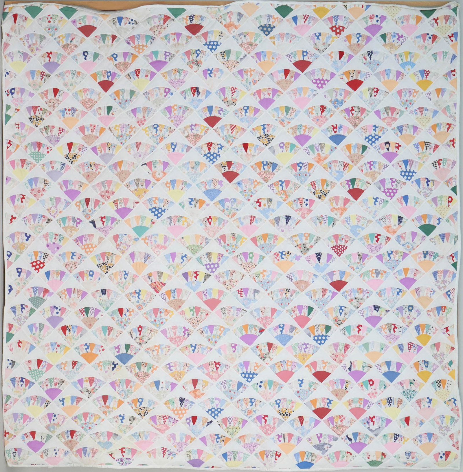 Vintage Hand Stitched Cotton Fan Quilt: Vintage Hand Stitched Cotton Fan Quilt American, circa 1930s Fitted on a later wooden stretcher. Provenance: Property from a private Southwestern collection. Appx 6 x 6 in. (15.2 x 15.2 cm.)