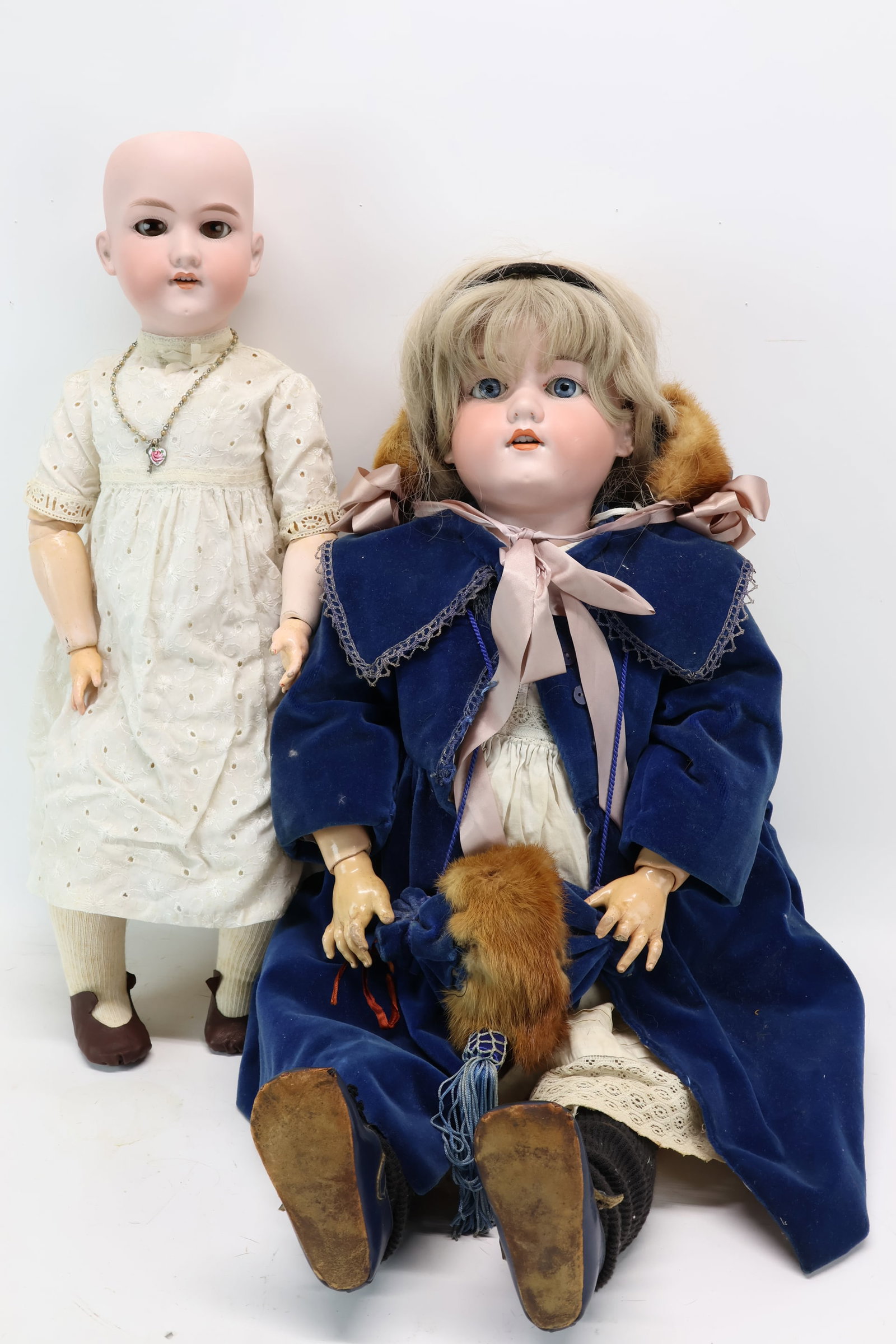 Large Armand Marseille Doll of Young Girl: Large Armand Marseille Doll of Young Girl Large Armand Marseille Doll of Young Girl wearing blue velvet jacket marked 390n D.R.G.M 246/1, measures 30" tall. Together with an Armand Marseille doll of