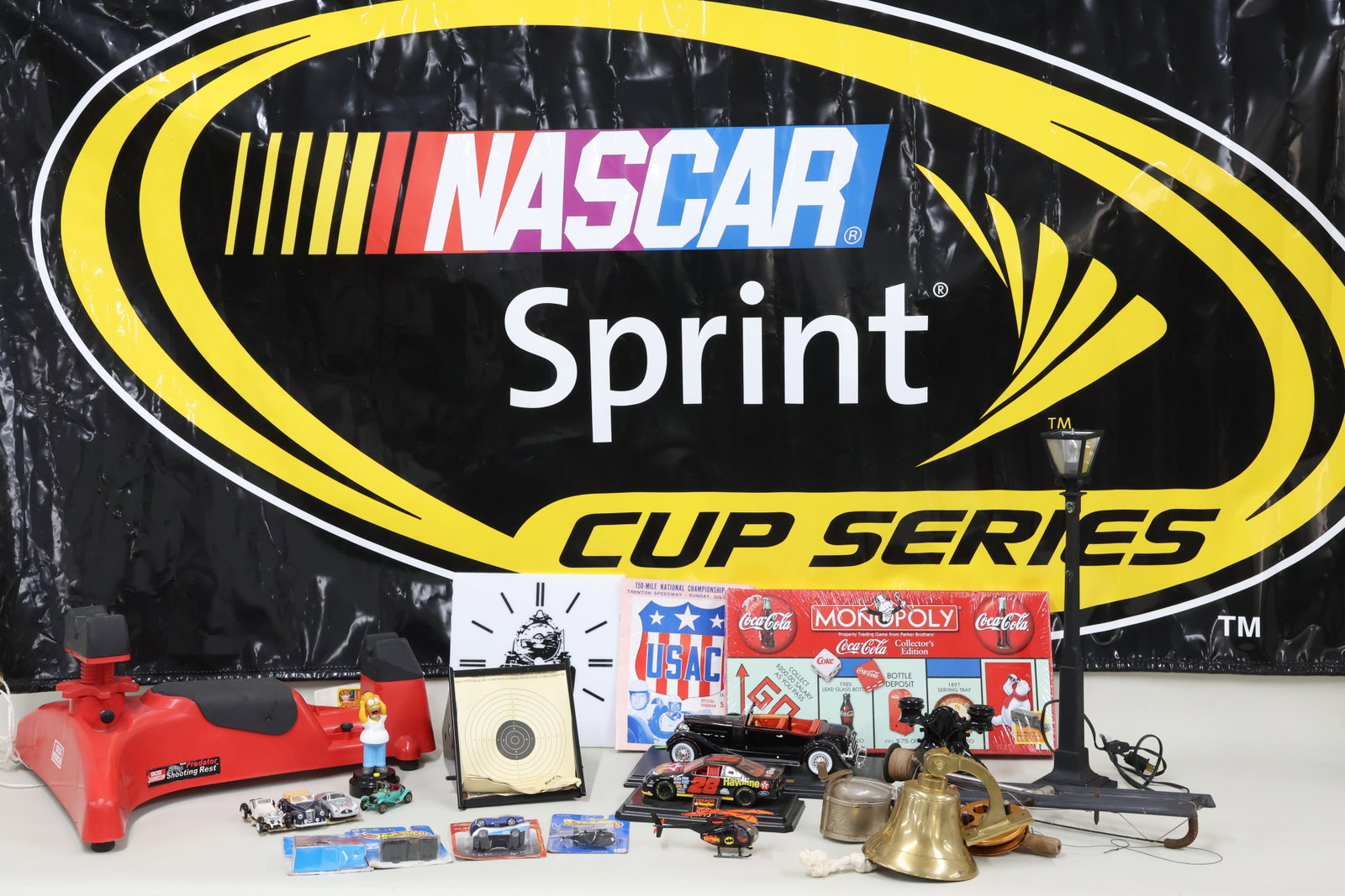 Group of Assorted Toys and Collectables: Group of Assorted Toys and Collectables Group of Assorted Toys and Collectables. Including Nascar Sprint Cup banner, Trenton Speedway 1962 program, Coca Cola Monopoly game, brass bell, Hot Wheels