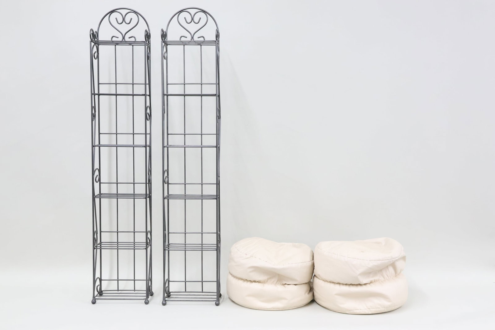 Pair of Gray Painted Metal Shelves: Pair of Gray Painted Metal Shelves Pair of Gray Painted Metal Shelves. Together with a pair of hassocks. Used condition, wear, worn, losses, stains to hassocks with small tears. Each shelf measures