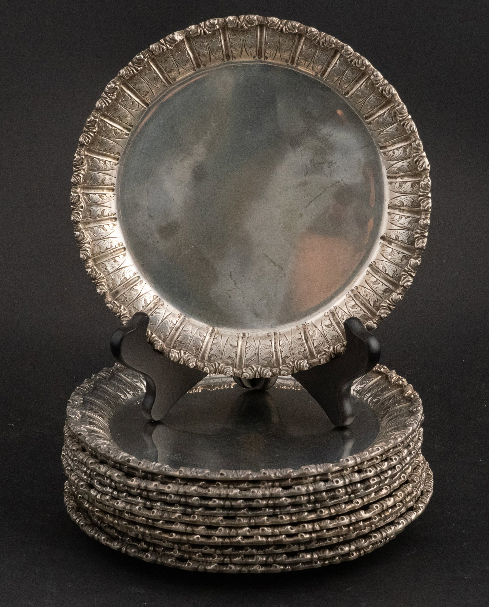 Twelve 800 Silver Leaf Decorated Plates: Twelve 800 Silver Leaf Decorated Plates Of impressive heft. 7 1/4"dia. Approx. 101 t.o. 7 in. (17.8 cm.)