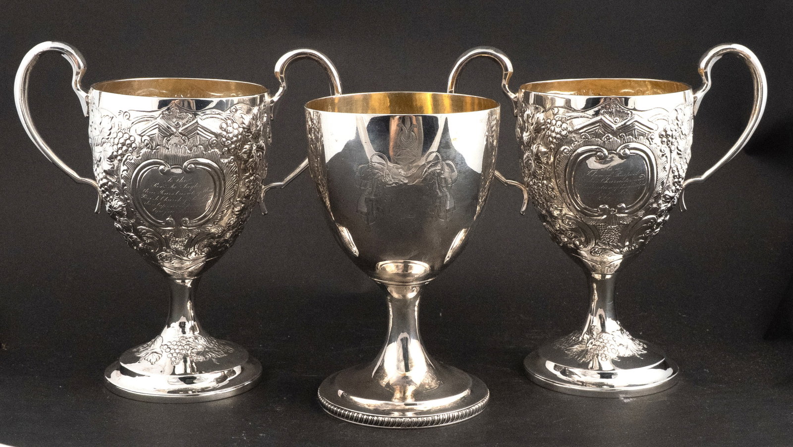 Two Georgian Irish Ecclesiastical Double Handled Cups: Two Georgian Irish Ecclesiastical Double Handled Cups James Taylor, Church of Bradford. Dated in the engraving 1828. Gilt interiors. With Dublin and Irish marks, makers mark worn, inscriptions,