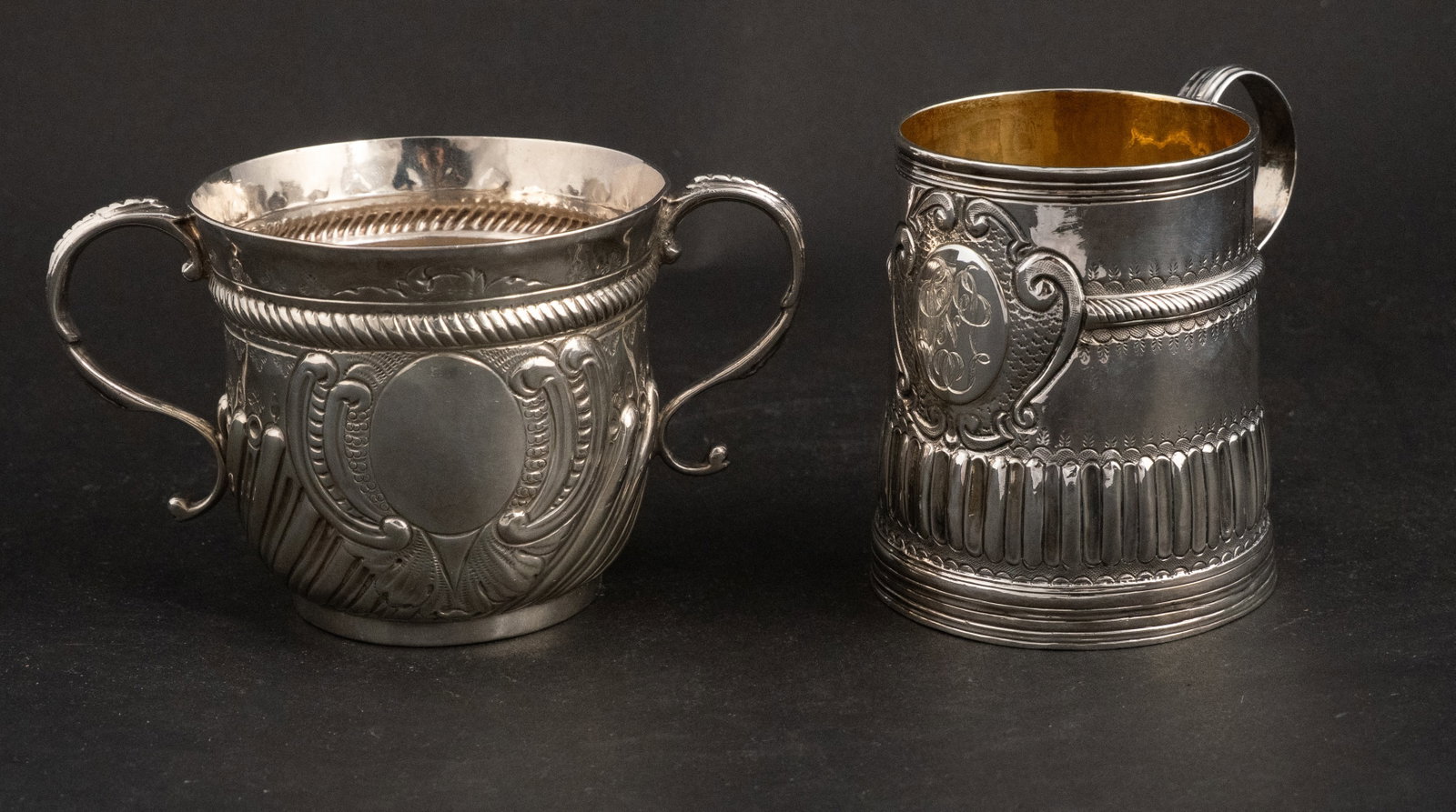 Two English Georgian Silver Handled Cups: Two English Georgian Silver Handled Cups One dated 1702 with the mark of John Cory. The other dated 1719 with mark of Thomas Mason. Approx. 10 t.o. 3 in. (7.6 cm.), Frame: 3 1/2 in. (8.9 cm.)