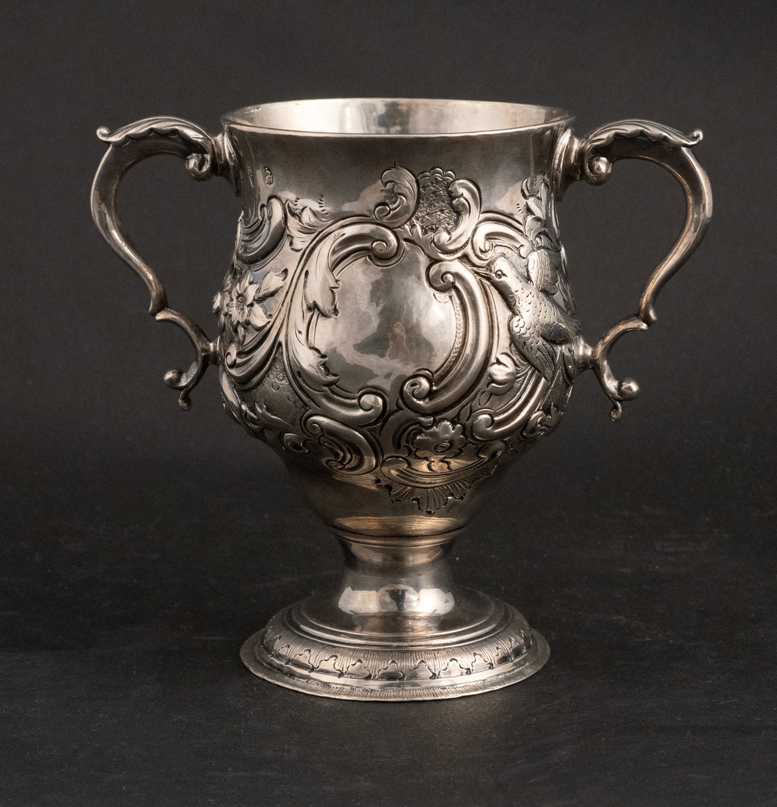 Matthew Walsh Irish Silver Footed Cup: Matthew Walsh Irish Silver Footed Cup Doubled handled with birds and floral decorations. 18th C. and approx. 15 t.o. 6 in. (15.2 cm.)