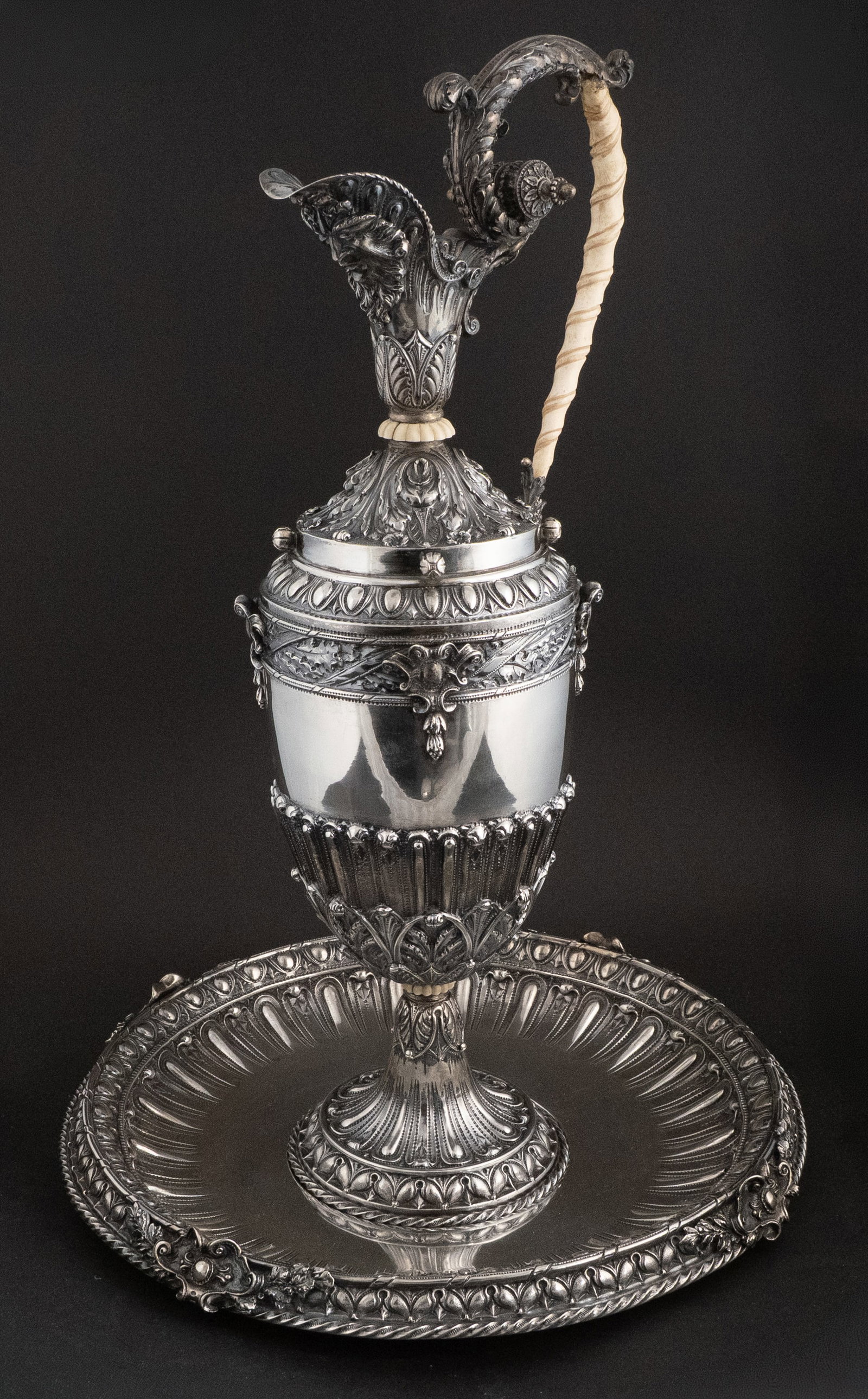Continental 800 Silver Ewer and Underplate: Continental 800 Silver Ewer and Underplate Of impressive size and decoration. Together with a custom silver metal floral insert, not weighed. Approx. 131 total t.o. 22 in. (55.9 cm.), Frame: 15 in.