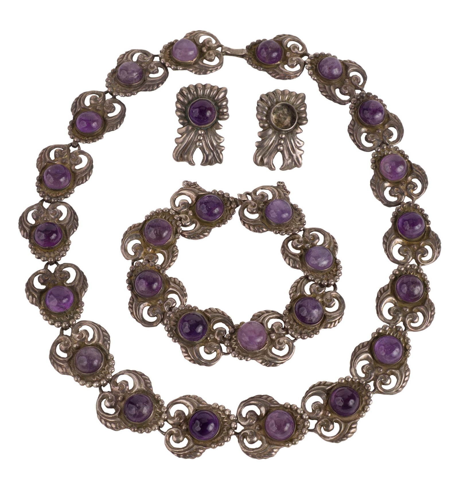 Mexican Sterling Silver Jewelry Suite: Mexican Sterling Silver Jewelry Suite Comprising, a necklace, bracelet, and earrings, inset with amethyst cabochons (one missing from earring) Necklace: 18 1/4 in. (46.4 cm.)
