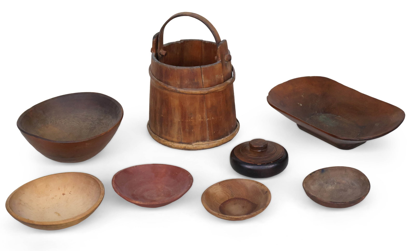 Group of Wood Trenchers, Bowls, and Plates: Group of Wood Trenchers, Bowls, and Plates Together with a wood bucket. 8 pieces Provenance: Property of a Private Bernardsville, NJ Collection Largest: 16 1/2 x 11 1/2 in. (41.9 x 29.2 cm.)