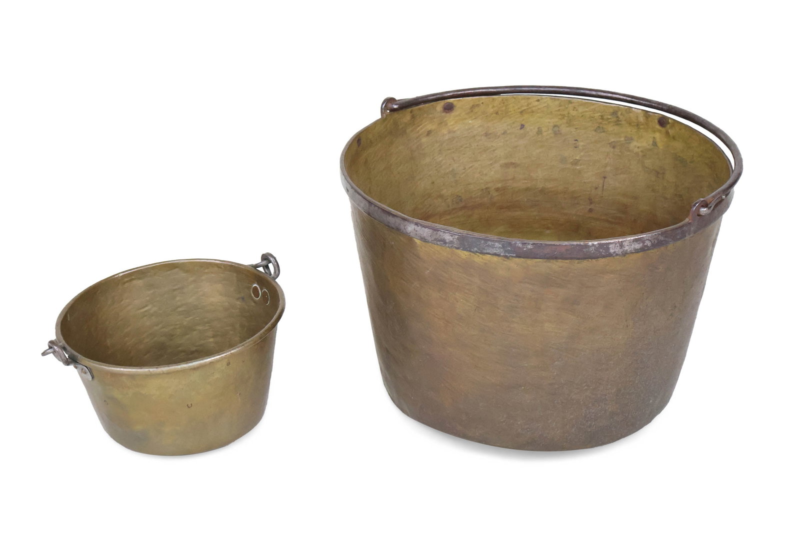 Two Brass Swing Handled Buckets: Two Brass Swing Handled Buckets American, 19th/20th C. Provenance: Property of a Private Bernardsville, NJ Collection Largest: 11 1/4 x 16 1/2 in. (28.6 x 41.9 cm.)
