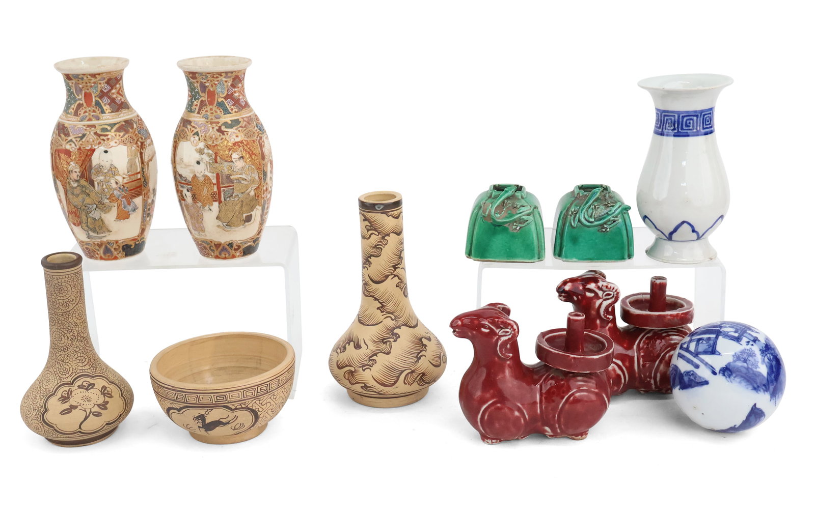 Group of Asian Porcelain Table Articles: Group of Asian Porcelain Table Articles Including, a pair of Satsuma vases, two earthenware vases, a pair of red-glazed rams, and a blue and white ball. 10 pieces Largest: 6 1/2 x 4 in. (16.5 x 10.2