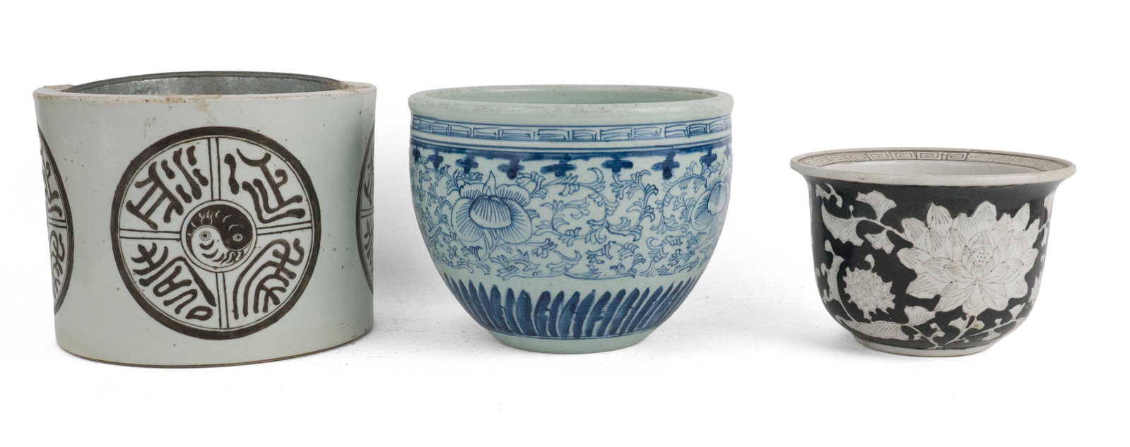 Three Chinese Style Porcelain Planters: Three Chinese Style Porcelain Planters One blue and white and two black and white. Largest: 7 1/2 x 10 1/4 in. (19.1 x 26 cm.)