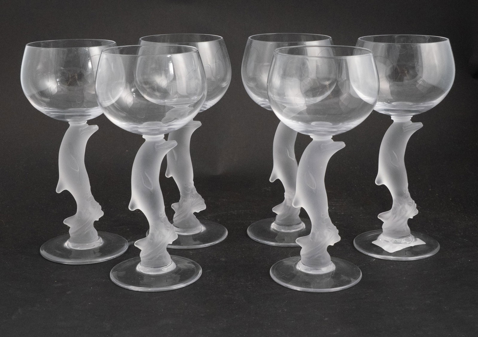 Six Dolphin Stem Frosted Wine Glasses: Six Dolphin Stem Frosted Wine Glasses Group of six dolphin form frosted glasses. Colorless glass. Unsigned, possibly Bayel. 6 3/4 x 2 3/4 in. (17.1 x 7 cm.)