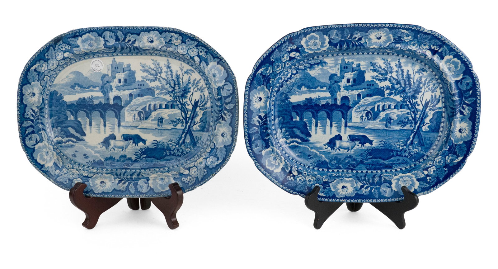 Two Staffordshire Blue Transferware Platters: Two Staffordshire Blue Transferware Platters Maker Unknown, Circa 1825. Both unmarked. Provenance: Casco Bay Auctions, Freeport, ME, Feb 6, 2022, lot 422 1 1/2 x 15 x 11 3/4 in. (3.8 x 38.1 x 29.8 cm.