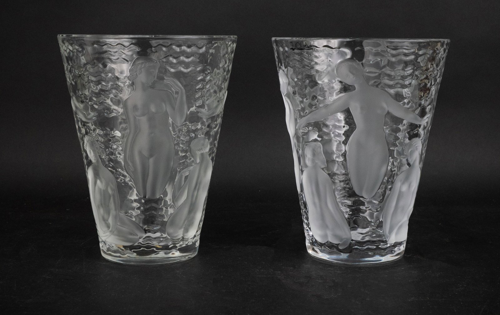 Pair of Lalique "Ondines" Crystal Vases: Pair of Lalique "Ondines" Crystal Vases Both with "Lalique" stickers, and etched on base. 9 1/4 x 7 1/2 in. (23.5 x 19.1 cm.)