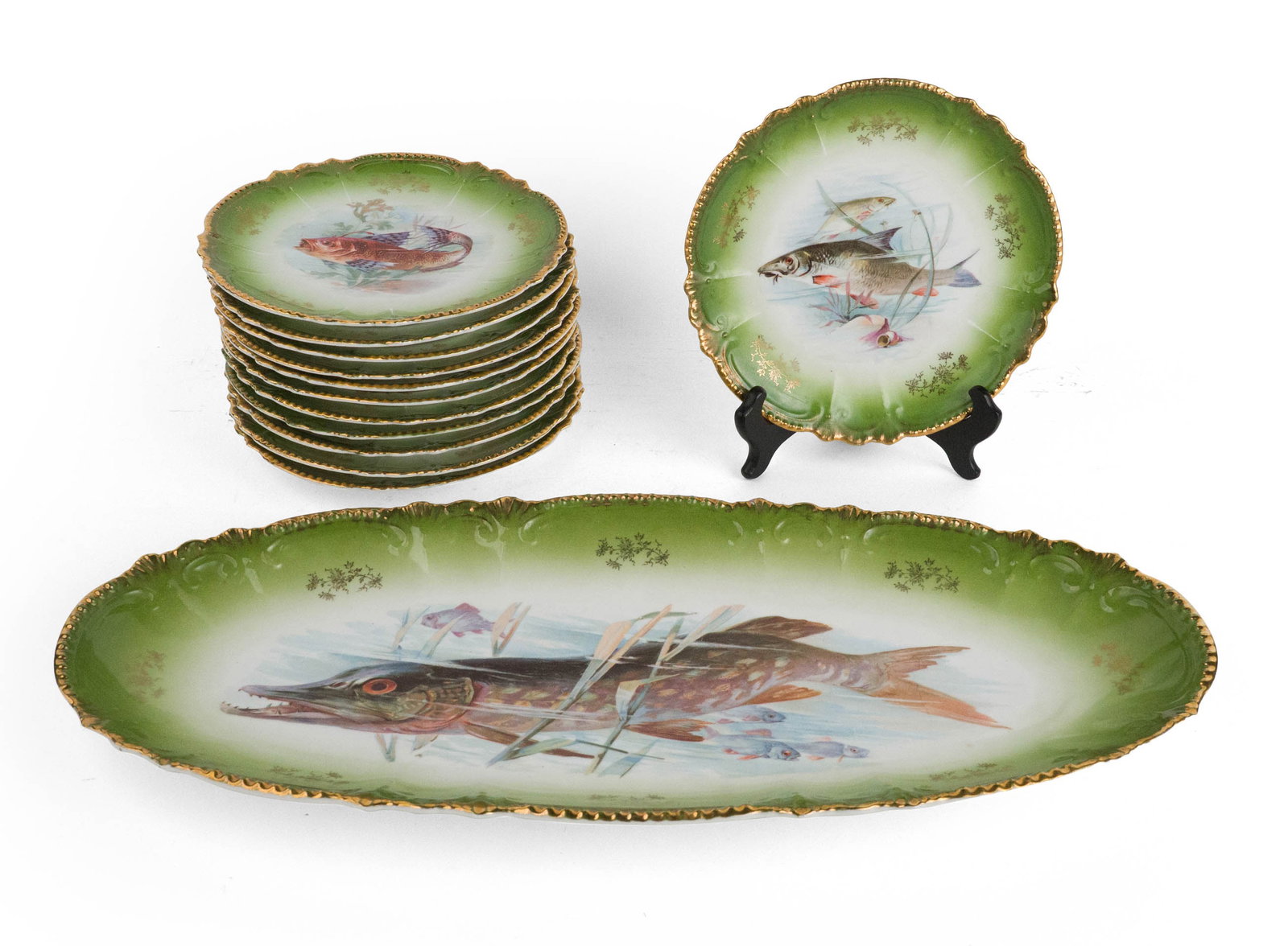 Royal Bavarian Porcelain Fish Service: Royal Bavarian Porcelain Fish Service Comprising, an oval platter and 12 plates. Plates: 1 x 8 1/2 in. (2.5 x 21.6 cm.), Platter: 2 x 22 x 9 3/4 in. (5.1 x 55.9 x 24.8 cm.)