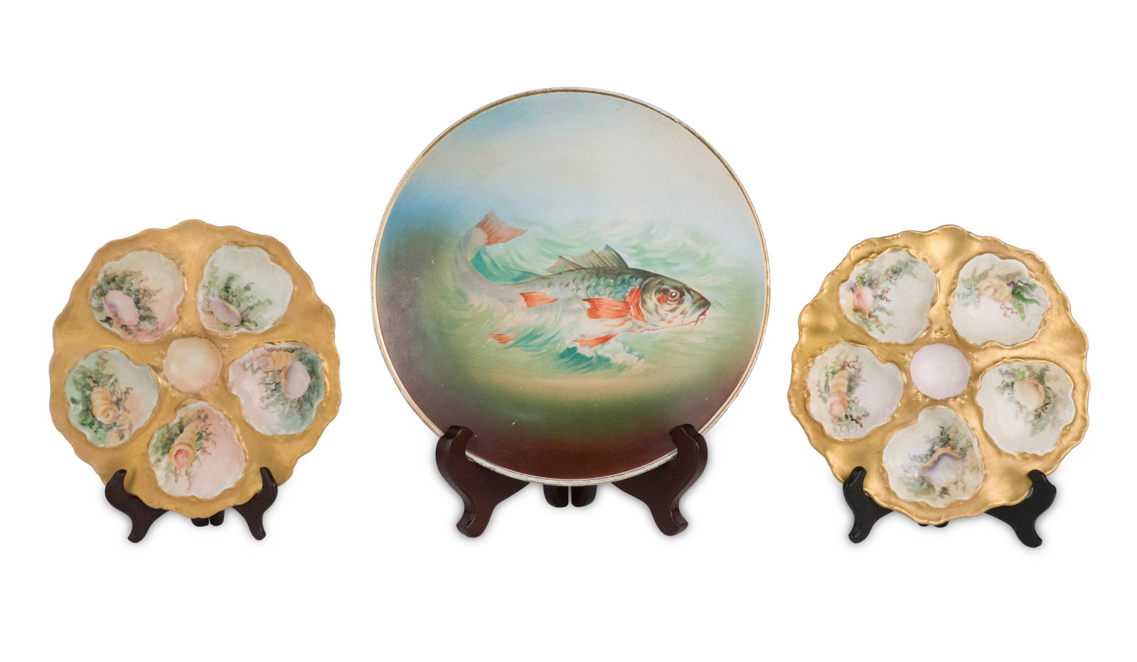 Two Limoges Oyster Plates: Two Limoges Oyster Plates T and V Limoges, France. 9.5"dia. Together with a large circular gilt decorated fish platter. 13"dia. 9 1/2 in. (24.1 cm.)