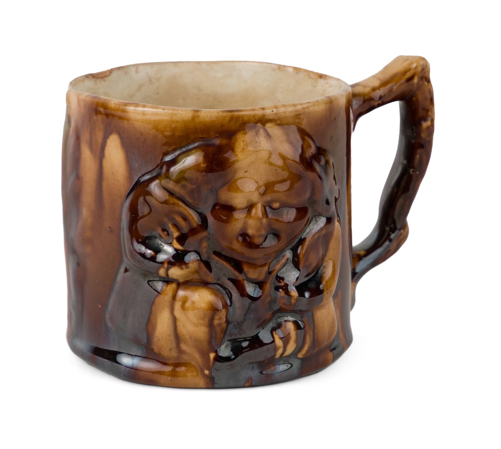 New Jersey Relief-Molded Rockingham-Glazed Toby Mug with Frog, Attributed to Daniel Regan: New Jersey Relief-Molded Rockingham-Glazed Toby Mug with Frog, Attributed to Daniel Regan Thick syrupy mottled Rockingham glaze with sparse blue flint enamel accents over buff/yellowware body, cylindr