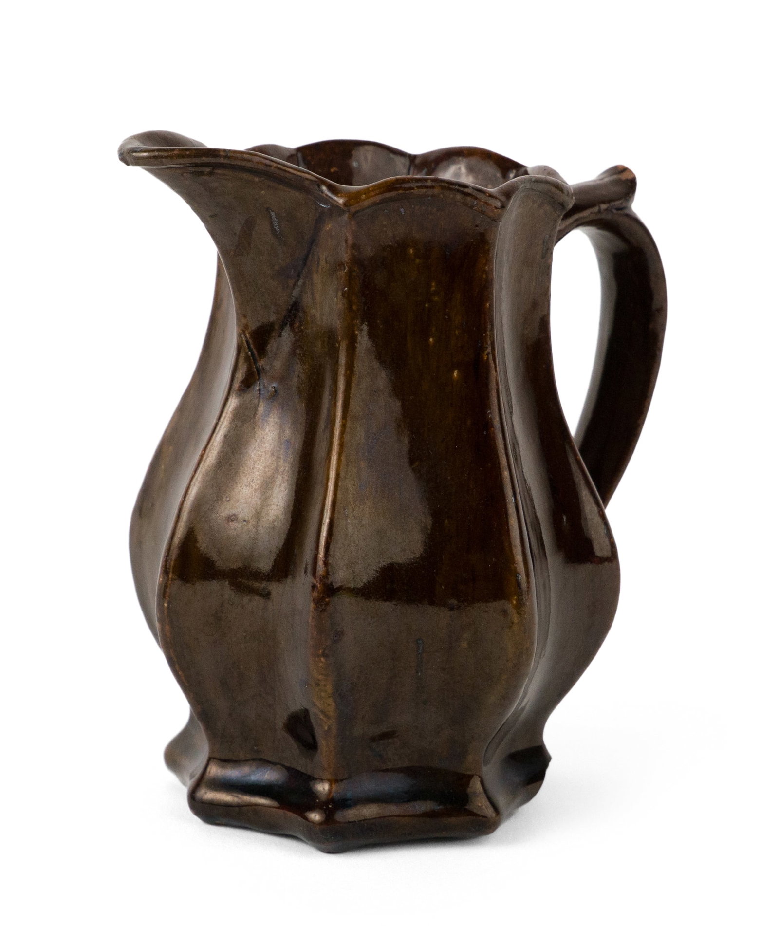 Stamped "A. O." Relief-Molded Redware Creamer / Small Pitcher, Possibly New England: Stamped "A. O." Relief-Molded Redware Creamer / Small Pitcher, Possibly New England Red earthenware with a thick dark streaked/speckled manganese and lead glaze; tall pear-shaped low-bellied octagonal