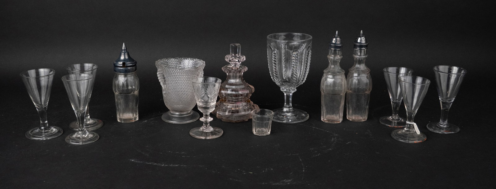 Group of Colorless Glass Table Articles: Group of Colorless Glass Table Articles Comprising, a Bakewell, Page and Bakewell cut glass wine glass, four blown glass wine glasses, a spooner in the popcorn pattern, a cable pattern goblet, a
