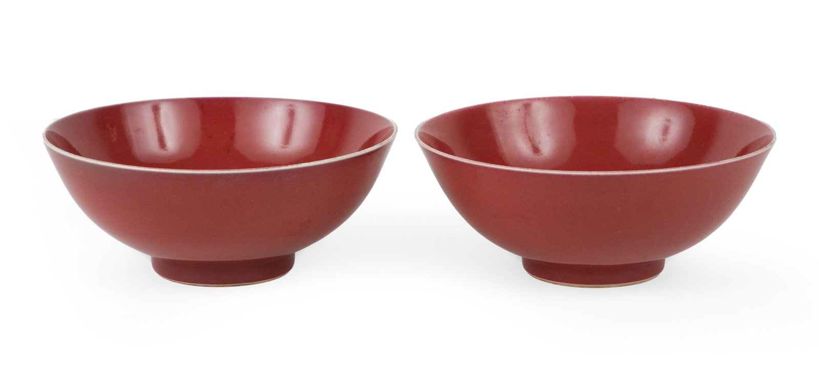 Pair of Chinese Oxblood Glazed Porcelain Bowls: Pair of Chinese Oxblood Glazed Porcelain Bowls Marked underside, Qing Dynasty. 6 1/2 in. (16.5 cm.)