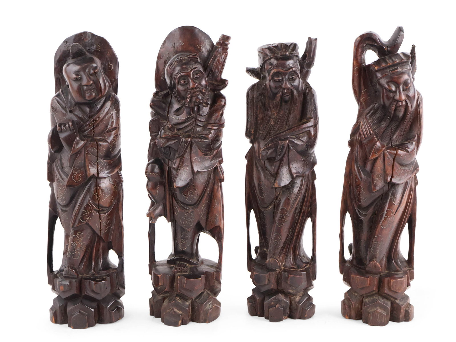 Four Carved Hardwood Sculptures of Taoist Immortals: Four Carved Hardwood Sculptures of Taoist Immortals Possibly Qing Dynasty. Cracks losses, wear. 14 1/2 x 4 x 3 3/4 in. (36.8 x 10.2 x 9.5 cm.)