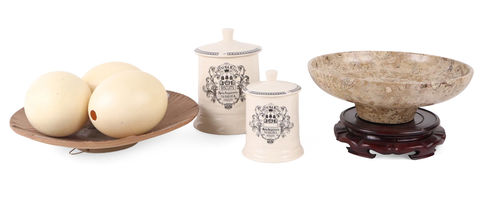 Three Faux Ostrich Eggs: Three Faux Ostrich Eggs Together with a modern ceramic dish, a stone dish, and two Fortnum and Mason biscuit jars. Ceramic Bowl: 2 3/4 x 14 1/4 in. (7 x 36.2 cm.)