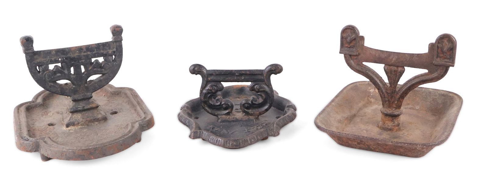 Three Cast Iron Boot Scrapers: Three Cast Iron Boot Scrapers English and American, 19th C. Comprising one marked "A. (Archibald) Kenrick and Sons/No. 677" Another marked "J. (John) Savory's Sons, New York" And a third unmarked, but