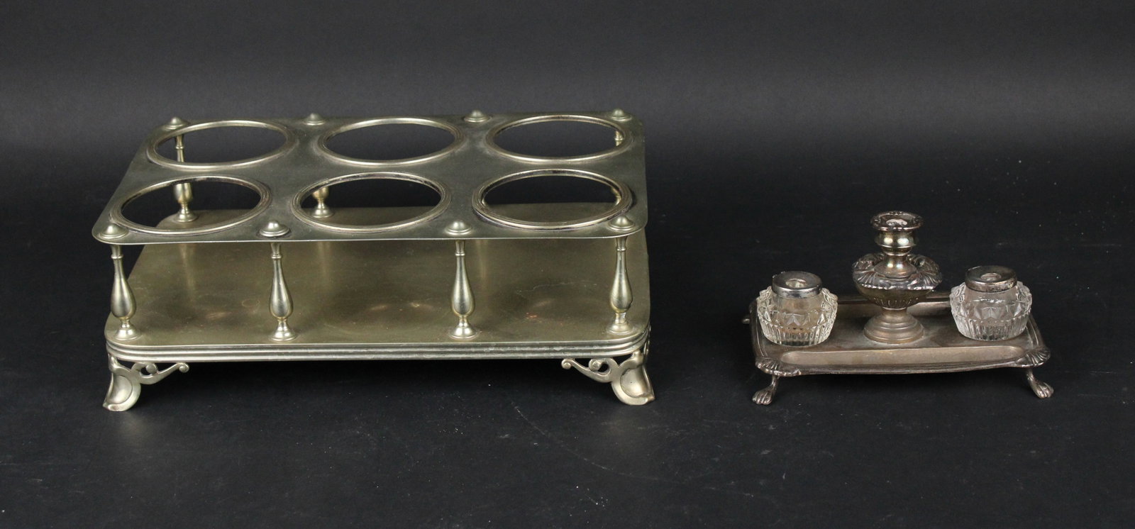 English Silvered Brass Six Bottle Frame: English Silvered Brass Six Bottle Frame Late 19th C. Together with an English inkstand/taper stand, c. 1800 Largest: 5 x 15 x 9 1/2 in. (12.7 x 38.1 x 24.1 cm.)