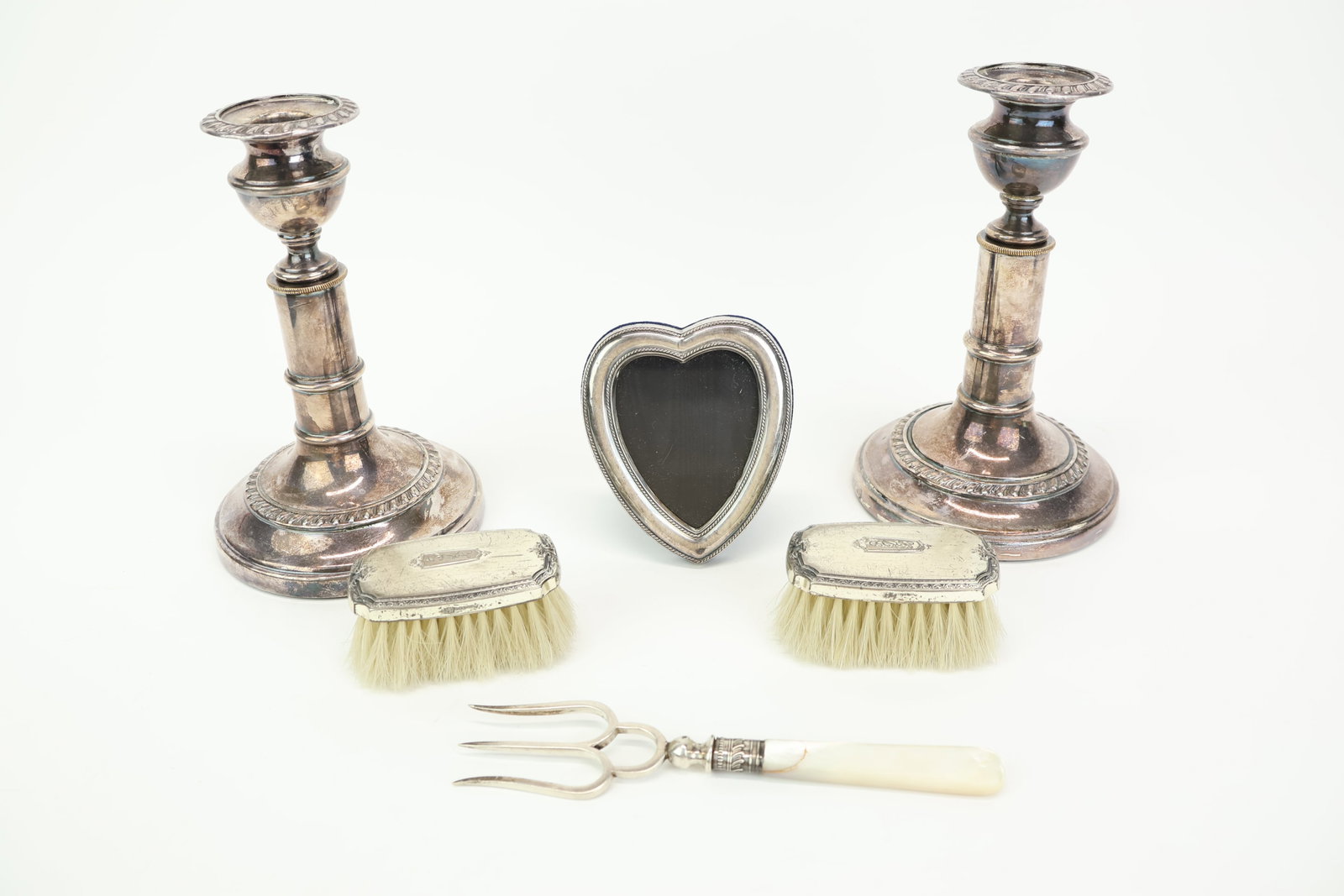 Group of Assorted Silver Articles: Group of Assorted Silver Articles Group of Assorted Silver Articles. Comprising a Roberts & Belle sterling silver and mother of pearl handle bread fork, a pair of sterling silver vanity brushes