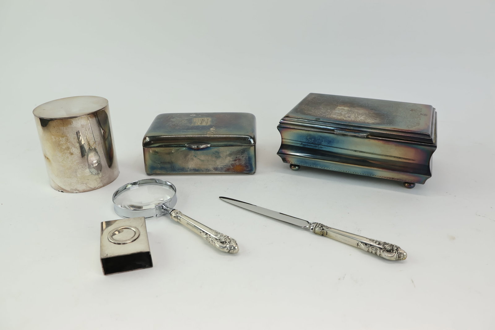 Group of assorted silver plated Desk articles: Group of assorted silver plated Desk articles Group of assorted silver plated Desk articles comprising of Wallace Grand Baroque sterling silver magnifying glass and letter opener. Christofle, covered 
