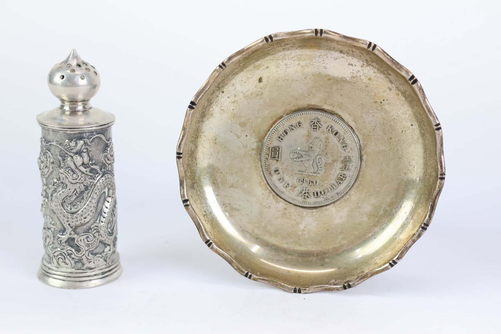 Chinese Export Silver Kwan Wo Pepper Pot: Chinese Export Silver Kwan Wo Pepper Pot Chinese Export Silver Kwan Wo Pepper Pot 2 3/4" tall x 1" dia. Together with Tachhing sterling silver 1960 Hong Kong one dollar nut dish. 3" dia. Both items