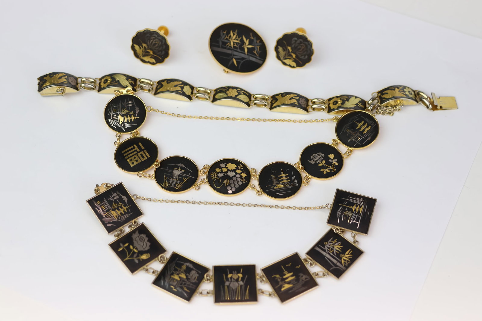 Vintage Group of Assorted Amita Damascene Jewelry: Vintage Group of Assorted Amita Damascene Jewelry Vintage Group of Assorted Amita Damascene Jewelry. Comprising two bracelets and a brooch. Together with a similar Japanese floral and bird inlaid