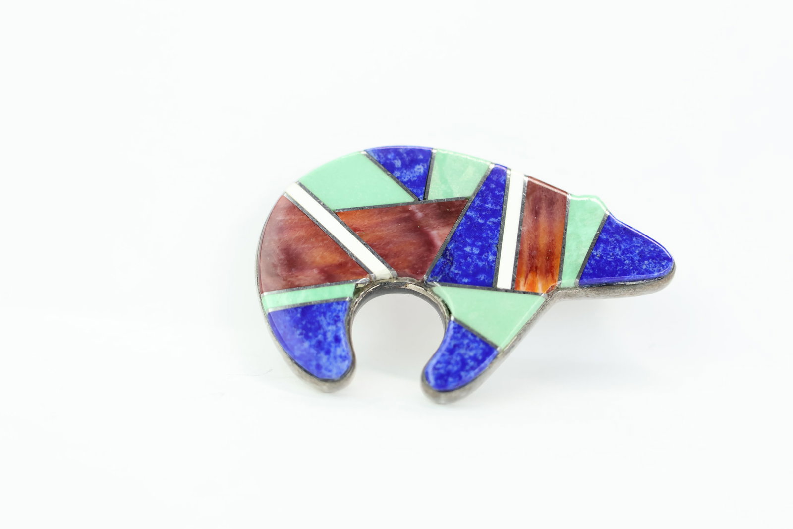 Native American Sterling Silver Bear Pin: Native American Sterling Silver Bear Pin Native American Sterling Silver Bear Pin having pendant loop and decorated with turquoise, lapis, and other inset stones; used condition; measures approximatel