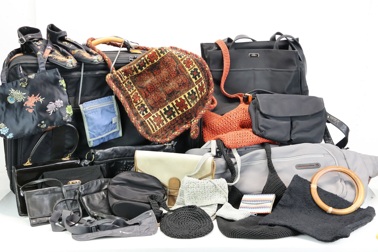 Large Group Of Assorted Vintage Handbags: Large Group Of Assorted Vintage Handbags Large Group Of Assorted Vintage Handbags. Including a Christian Dior suitcase, large gray duffle bag and various size purses some of which are crocheted and le
