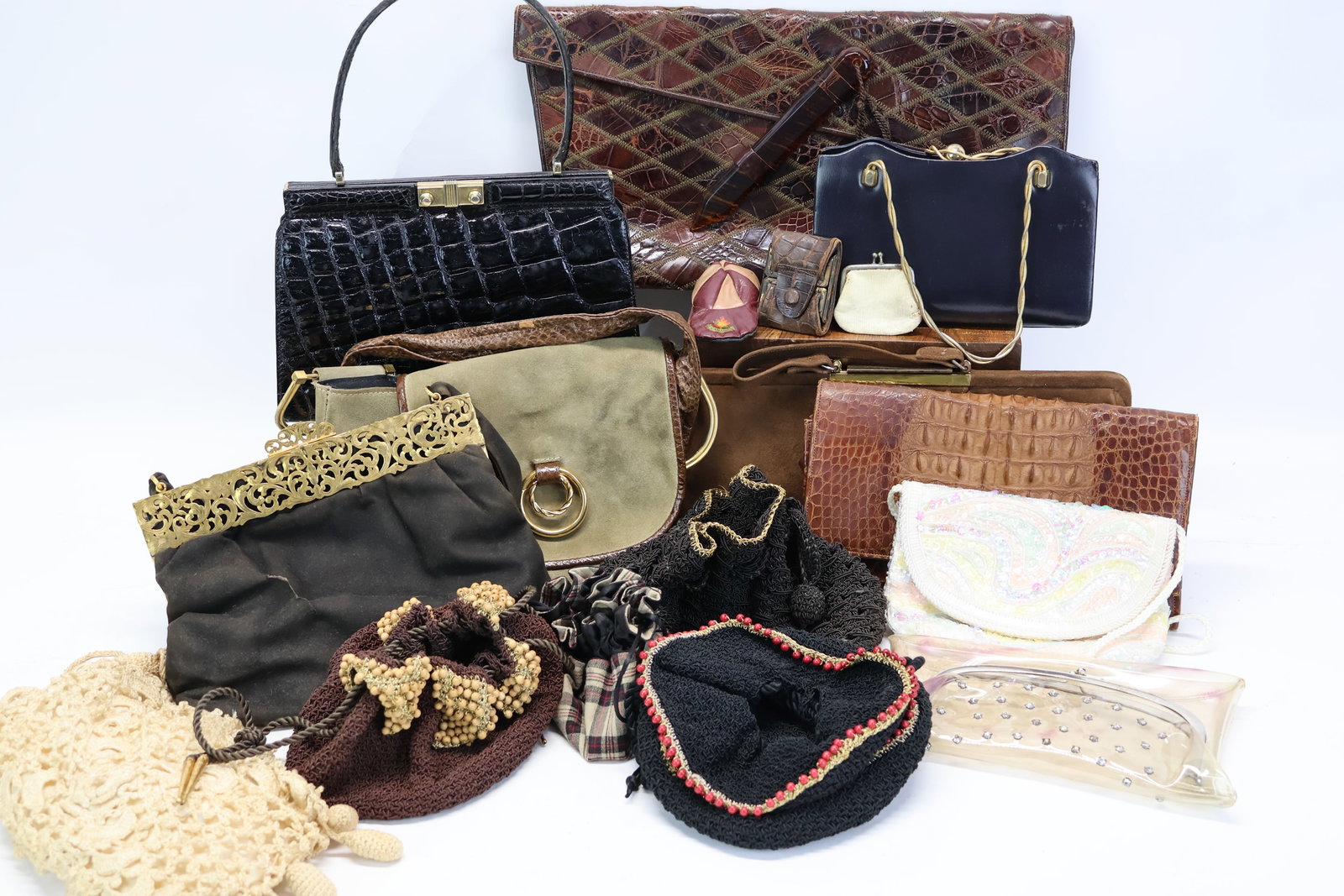 Group Of Assorted Vintage Handbags: Group Of Assorted Vintage Handbags Group Of Assorted Vintage Handbags. Including crocheted and beaded flapper style bags, 2 alligator bags one marked "Deitsch", a small black "Saks 5th Avenue" bag, an