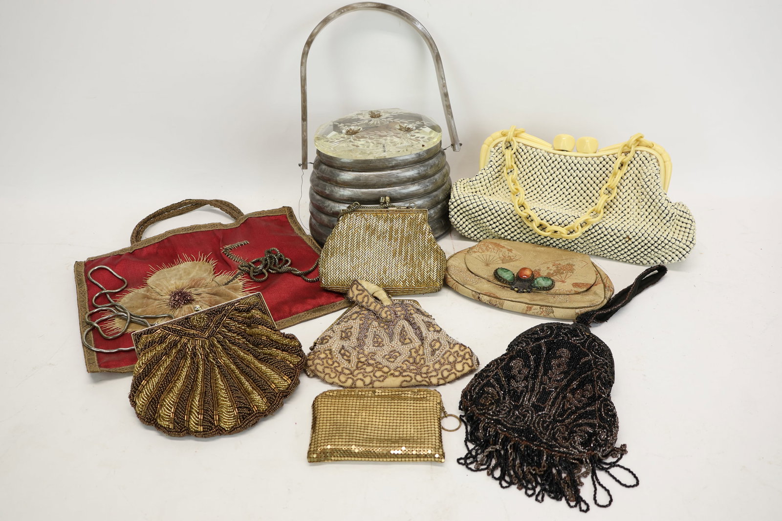 Group Of Assorted Vintage Handbags: Group Of Assorted Vintage Handbags Group Of Assorted Vintage Handbags. Comprising 4 Art Deco style beaded bags and a coin purse, a Whiting & Davis Alumesh bag with a chunkt celluloid chain handle, a "