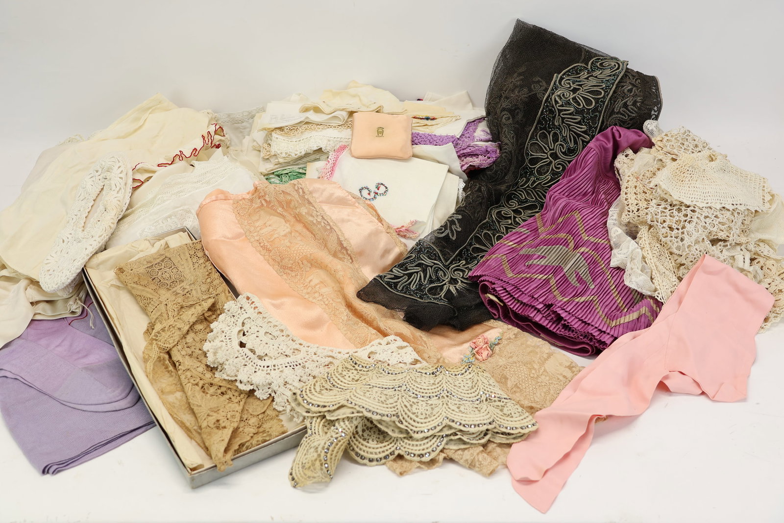 Vintage Group of Assorted Ladies' Undergarments and Handkerchiefs: Vintage Group of Assorted Ladies' Undergarments and Handkerchiefs Vintage Group of Assorted Ladies' Undergarments and Handkerchiefs. Together with assorted vintage collars and a beaded table runner.