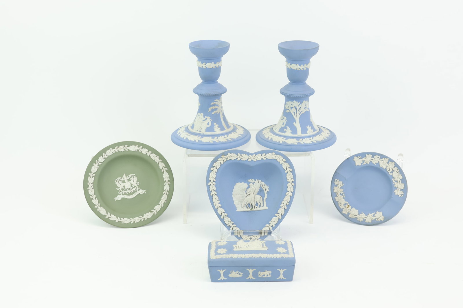Group of Wedgwood Jasperware Table Articles: Group of Wedgwood Jasperware Table Articles Group of Wedgwood Jasperware Table Articles. Comprising, a pair of candlesticks, a heart shaped bowl, two small dishes, and a small box. Used condition,