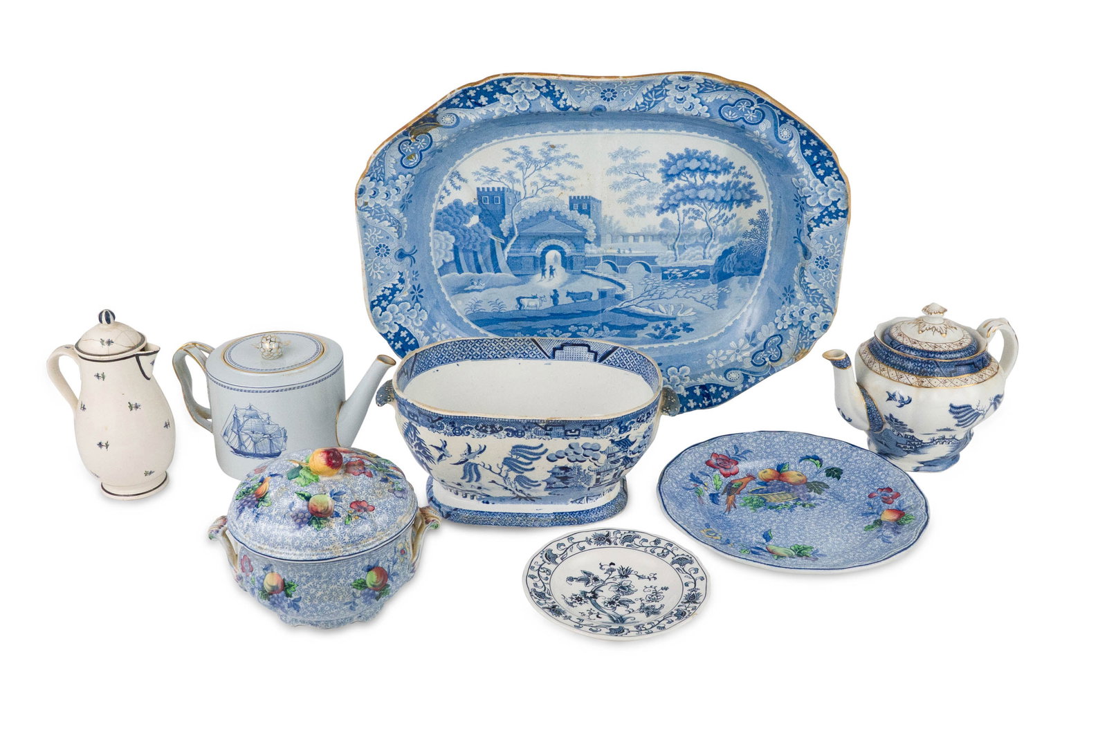 Eight Blue and White Porcelain Table Articles: Eight Blue and White Porcelain Table Articles Including, a transfer-decorated well-and-tree platter, a Royal Doulton teapot, a Spode teapot, a Copeland Spode covered tureen and matching plate, and a N