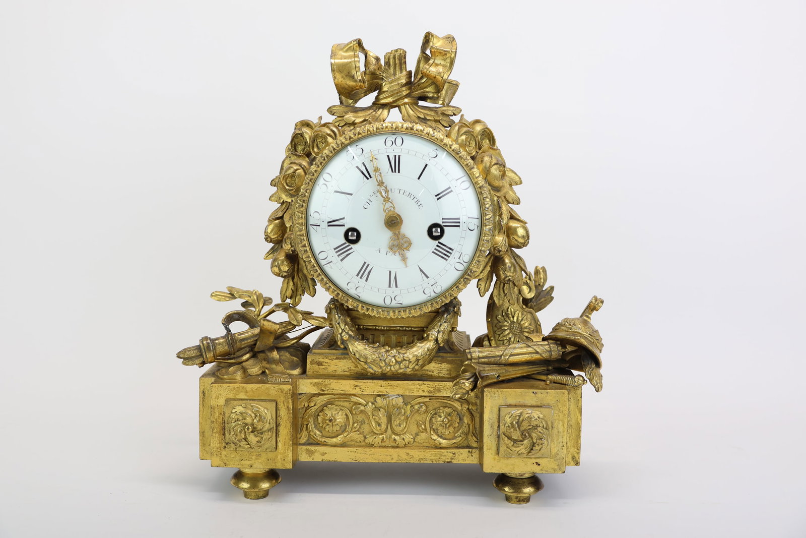 Louis XVI Style Gilt Metal Mantel Clock: Louis XVI Style Gilt Metal Mantel Clock Louis XVI Style Gilt Metal Mantel Clock, dial inscribed "Chas. du Tertre a Paris". Used unknown condition, wear, worn. 12 1/2"h x 11 1/2"w x 5"d