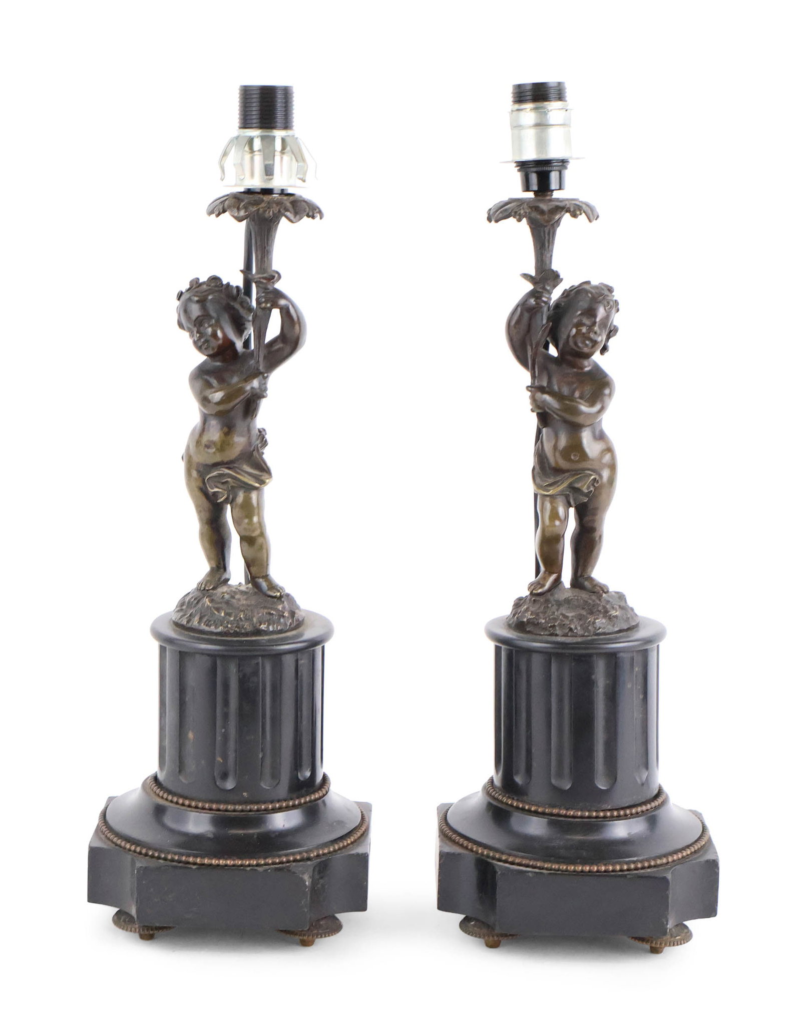 Two Neoclassical Style Figural Table Lamps: Two Neoclassical Style Figural Table Lamps With putti holding candle sockets on marble bases. Surface distress, chips, wear. Provenance: Property from a Private New York and German Collector Overall: